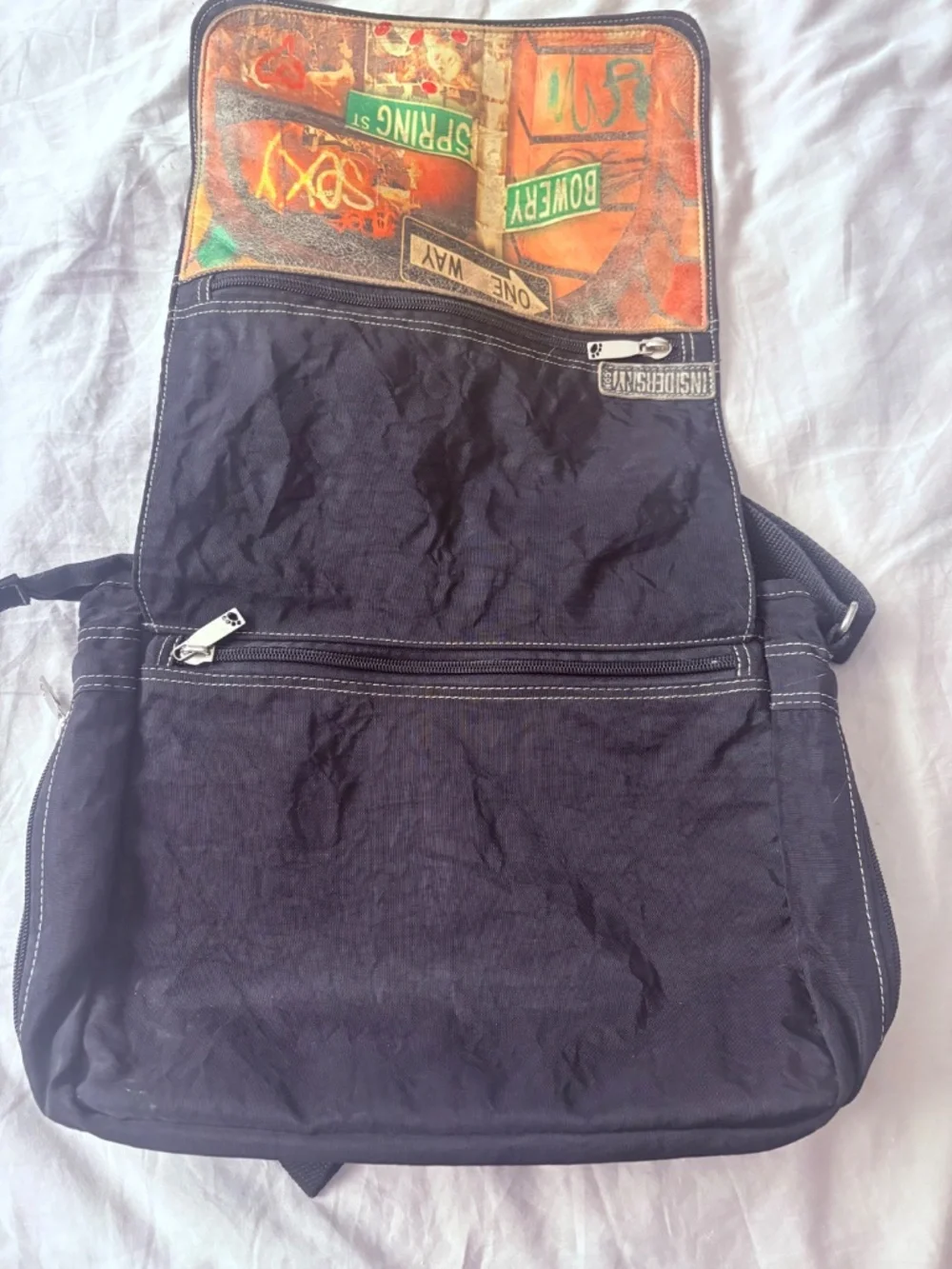 Inside NY unisex messenger bag.